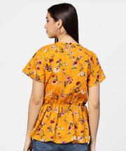 Yellow printed short sleeve with a gathered peplum style top