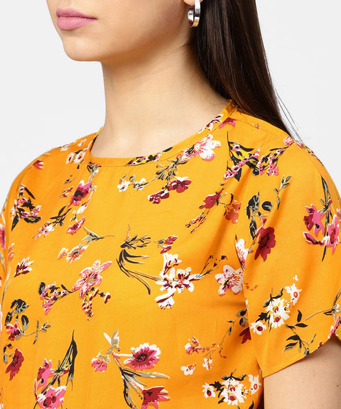 Yellow printed short sleeve with a gathered peplum style top