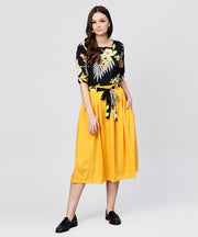 Black printed half sleeve tops with yellow calf length skirt with belt