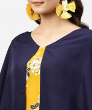 Yellow printed tunic with attached cape sleeves and V-neck