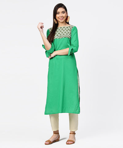 Green yoke printed half sleeve cotton kurta with cream ankle length pallazo