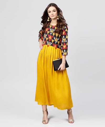Bright Yellow rayon A-line box pleated Maxi with attached Jacket till Yoke and emblished with tassels