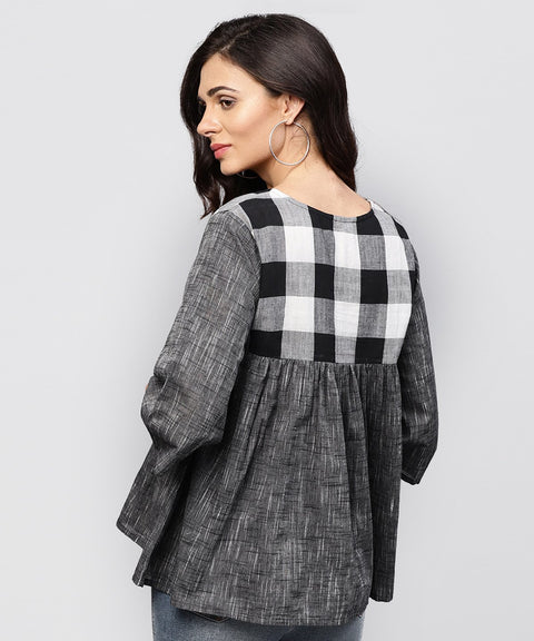 Grey top with V-neck and flared sleeves