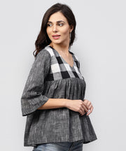 Grey top with V-neck and flared sleeves