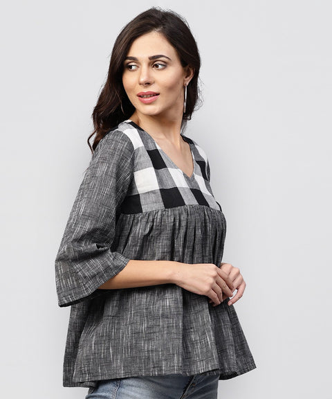 Grey top with V-neck and flared sleeves