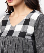 Grey top with V-neck and flared sleeves