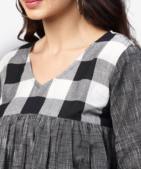 Grey top with V-neck and flared sleeves