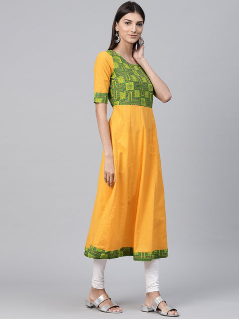 Yellow half sleeve cotton A-line kurta with printed yoke
