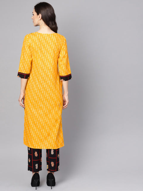 Yellow 3/4th sleeve cotton kurta with navy blue ankle length palazzo