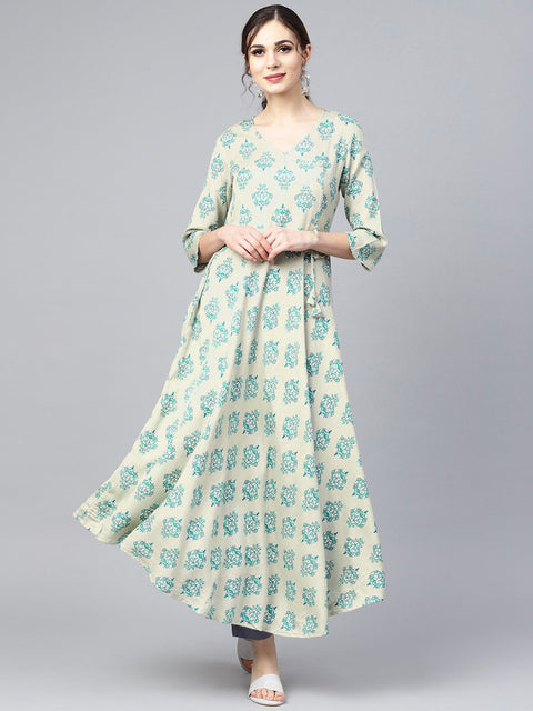 Sage green printed V-neck Angrakha style 3/4th assymetrical sleeve falred kurta with solid pants.