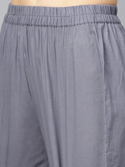 Sage green printed V-neck Angrakha style 3/4th assymetrical sleeve falred kurta with solid pants.