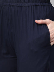 Beige with multi colored abstract print kurta with solid navy blue pallazos